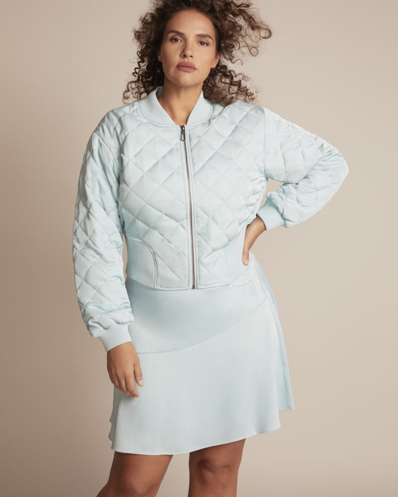 Front of a model wearing a size 14 Sita Quilted Jacket in Mint by 11 Honoré Collection. | dia_product_style_image_id:245341